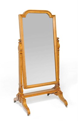 Lot 1363 - A 19th Century North European Satinwood Cheval Mirror, the shaped rectangular plate within tapering