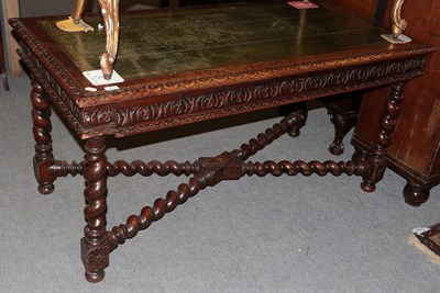 Lot 1251 - A Victorian oak library table in the 17th century taste, leather inset top, barley twist legs...