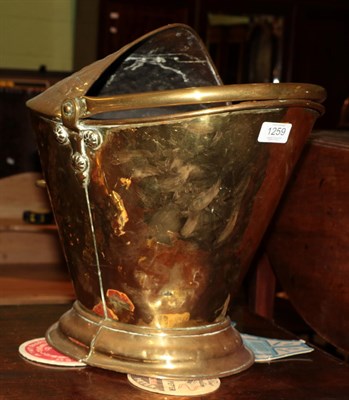 Lot 1259 - A 19th century brass helmet form coal scuttle