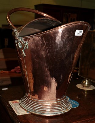 Lot 1260 - A copper helmet form coal scuttle