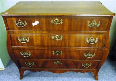 Lot 1366 - A 19th Century North European Mahogany Bombé Commode, the four graduated drawers with later...