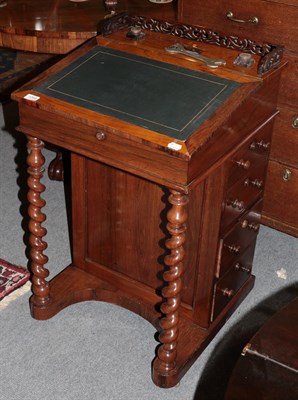Lot 1269 - A late Victorian rosewood Davenport with pierced gallery and barley twist supports