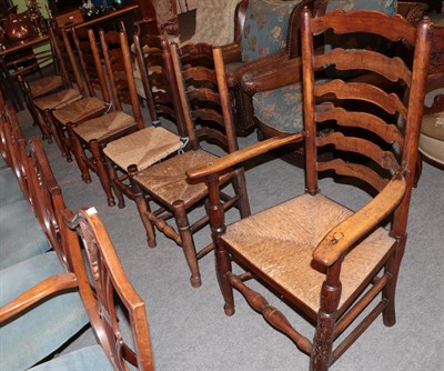 Lot 1293 - Seven rush seated ladder back chairs