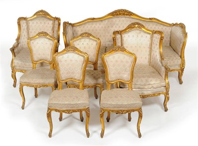 Lot 1371 - A Louis XV Style Gilt and Gesso Serpentine Shaped Settee, early 20th century, the flower...