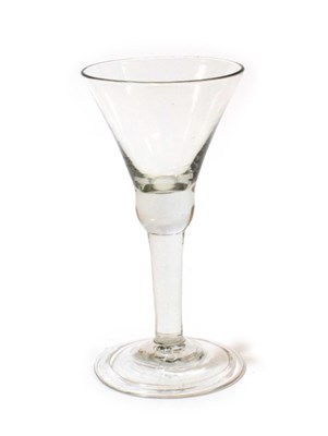 Lot 1004 - A Wine Glass, circa 1750, the trumpet bowl with basal knop, on a plain stem and folded foot, 16.5cm