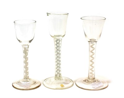 Lot 1017 - A Wine Glass, circa 1750, the rounded bucket bowl on a composite air and opaque twist stem,...