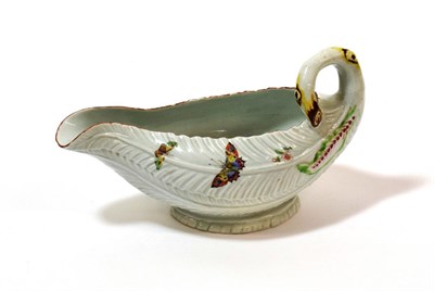Lot 1027 - A Worcester Porcelain Cos Lettuce Leaf Sauceboat, circa 1755, naturalistically modelled and painted
