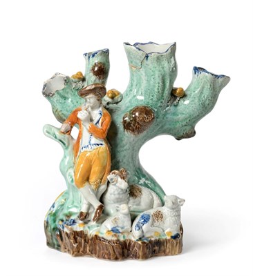 Lot 1044 - A Pratt Type Pottery Spill Vase Group, circa 1800, modelled as a shepherd and sheep standing before