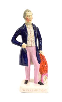 Lot 1055 - A Staffordshire Pottery Figure of the Duke of Wellington, mid 19th century, standing, 33cm high
