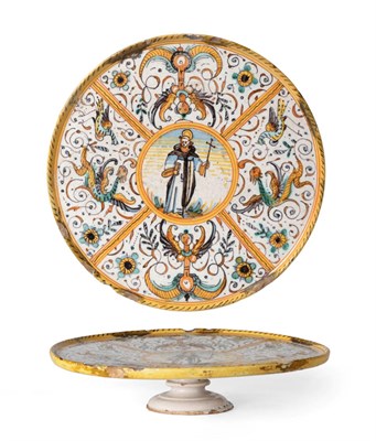 Lot 1073 - A Deruta Maiolica Tazza, 17th century, painted in colours with a saint within a border of panels of