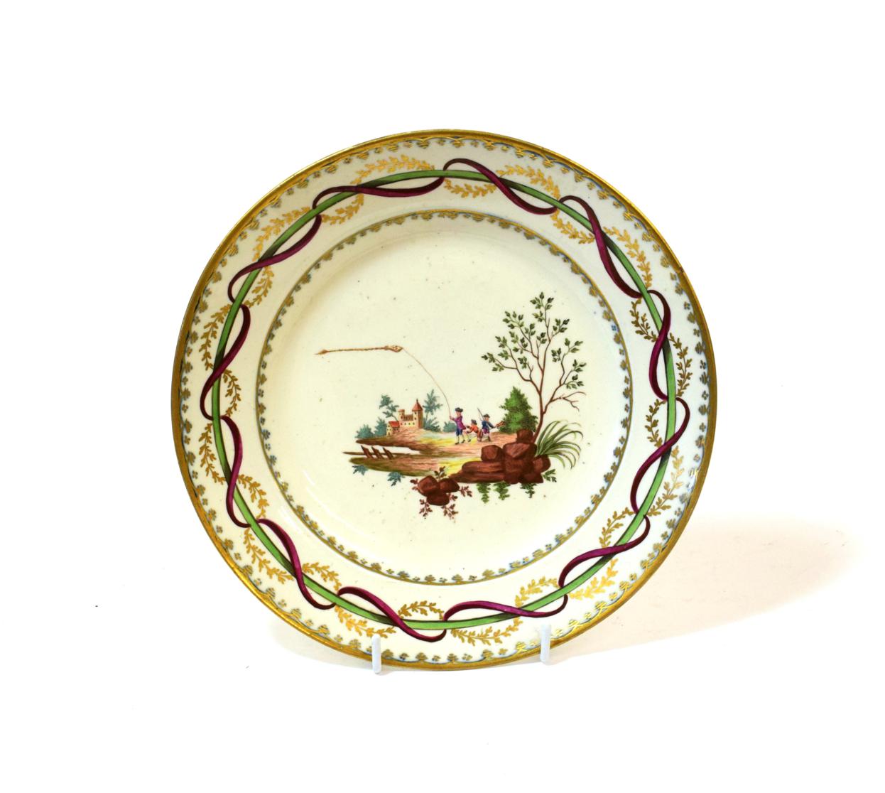 Lot 1078 - A Vienna Porcelain Soup Plate, circa 1800, painted with figures flying a kite in landscape within a