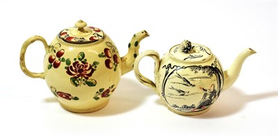 Lot 1080 - A Dutch Decorated English Creamware Teapot and Cover, circa 1770, painted in Jesuit style in...