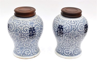 Lot 1091 - A Pair of Chinese Porcelain Baluster Jars, 19th century, painted in in underglaze blue with...