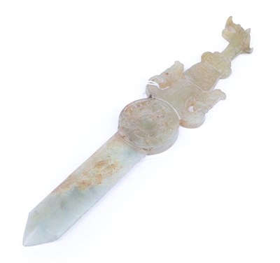 Lot 1097 - A Chinese Jade Knife, of archaic form, with mask and scroll handle, circular boss and geometric...