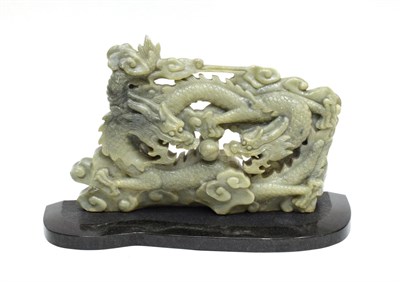 Lot 1102 - A Chinese Jade Type Figure of a Dragon, in Ming style, 35cm long