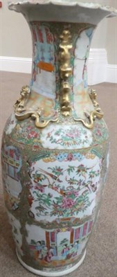Lot 1104 - A Cantonese Porcelain Vase, mid 19th century, of baluster form with mythical beast handles,...