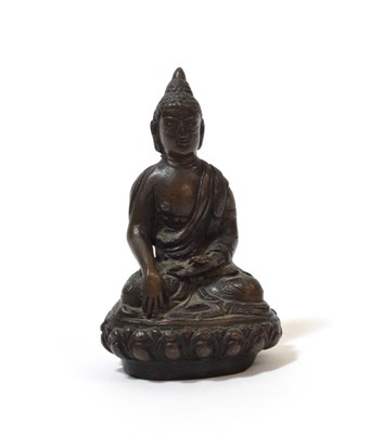 Lot 1113 - A South East Asian Bronze Figure of Buddha, probably 17th century, seated cross-legged on a...