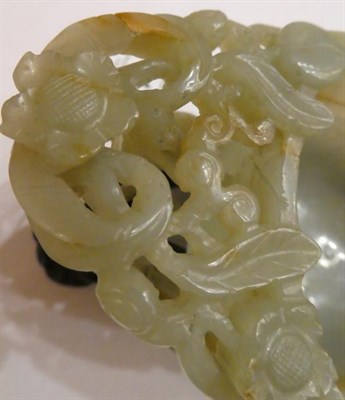 Lot 1116 - A Chinese Jade Libation Cup, in the form of a peach with pierced foliate scroll handle, 12cm...
