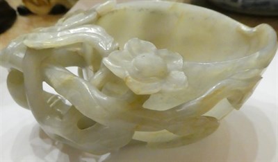 Lot 1117 - A Chinese Jade Libation Cup, of peach form with carved and pierced flowering and fruiting...