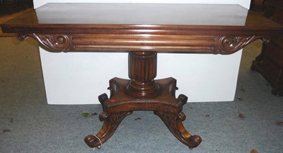 Lot 1387 - A Mahogany Foldover Card Table, circa 1830, with column frieze flanked by scrolling leaf carved...