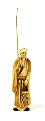 Lot 1127 - A Japanese Ivory Figure of a Fisherman, Meiji period, standing wearing flowing traditional...