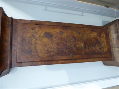 Lot 1138 - ~ A Walnut Longcase Clock, arched pediment, trunk and base with well figured veneers and...