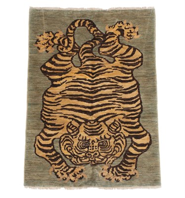 Lot 1179 - Modern Tibetan/Nepali Tiger Rug The field depicting a semi-naturalistic tiger pelt, 179cm by 126cm