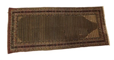Lot 1195 - Malayir Khelleh  West Iran, circa 1900 The pale camel boteh lattice field within spandrels and...