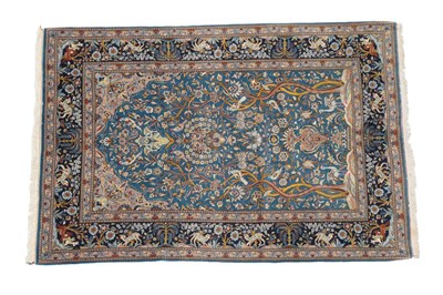 Lot 1197 - Kashan Prayer Rug Central Iran, circa 1960 The sky blue field centred by an urn beneath a lamp...