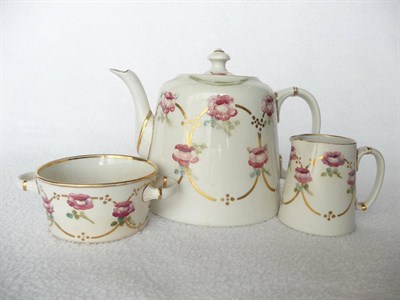 Lot 1404 - A Moorcroft Macintyre Three Piece Teaset, decorated with roses and gilt swags, comprising tea...