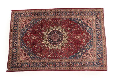 Lot 1203 - Mashad Carpet North East Khorasan, 20th century The burgundy field of vines around a flowerhead...