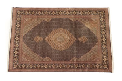 Lot 1206 - Tabriz Carpet Iranian Azerbaijan, circa 1960 The deep indigo Herati field centred by a cusped...