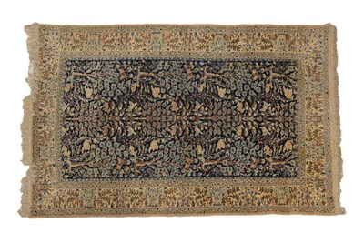 Lot 1214 - Nain Wool and Silk Rug Central Iran, circa 1960 The navy field woven with a pattern of birds, hares