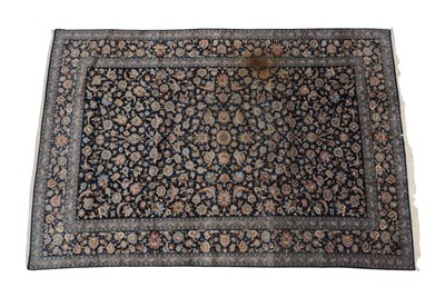 Lot 1217 - Kashan Carpet  Central Iran, circa 1960 The indigo field with an all over design of floral...