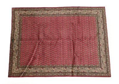 Lot 1219 - Tabriz Carpet Iranian Azerbaijan, circa 1970 The raspberry field of boteh enclosed by ivory borders