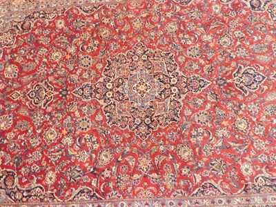 Lot 1220 - Kashan Carpet Central Iran, circa 1940 The raspberry field with central medallion surrounded by...