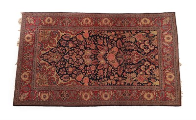 Lot 1224 - Kashan Prayer Rug Central Iran, circa 1930 The indigo field with an urn issuing flowers beneath the