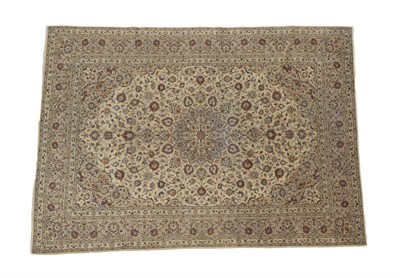 Lot 1235 - Kashan Carpet Central Iran, circa 1970 The cream field of palmettes and scrolling vines around...