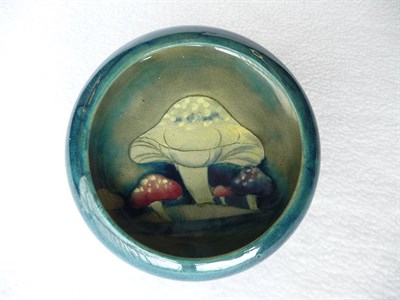 Lot 1409 - A William Moorcroft "Claremont Toadstool" Dish, on a green/blue ground, impressed factory...