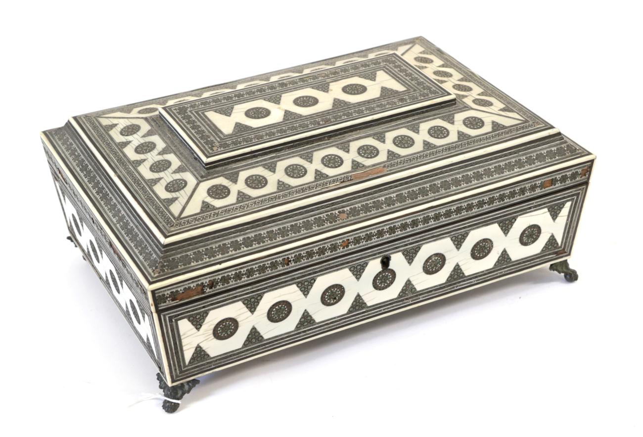 Lot 1271 - A Vizagapatam Ivory, Ebony and Sadeli Work Box, mid 19th century, of sarcophagus form with...