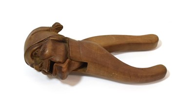 Lot 1281 - A Black Forest Type Nutcracker, late 19th century, as the head of a man wearing a cap, 18cm long
