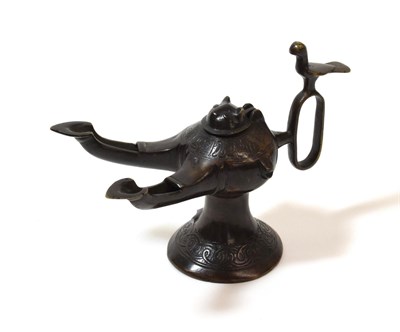 Lot 1291 - A Bronze Oil Lamp, in Classical style, of ovoid form with cat's mask cover and twin branches,...