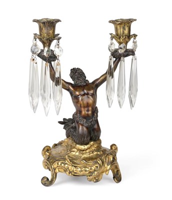 Lot 1292 - A Gilt and Patinated Bronze Twin-Light Candelabrum, probably French, mid 19th century, modelled...