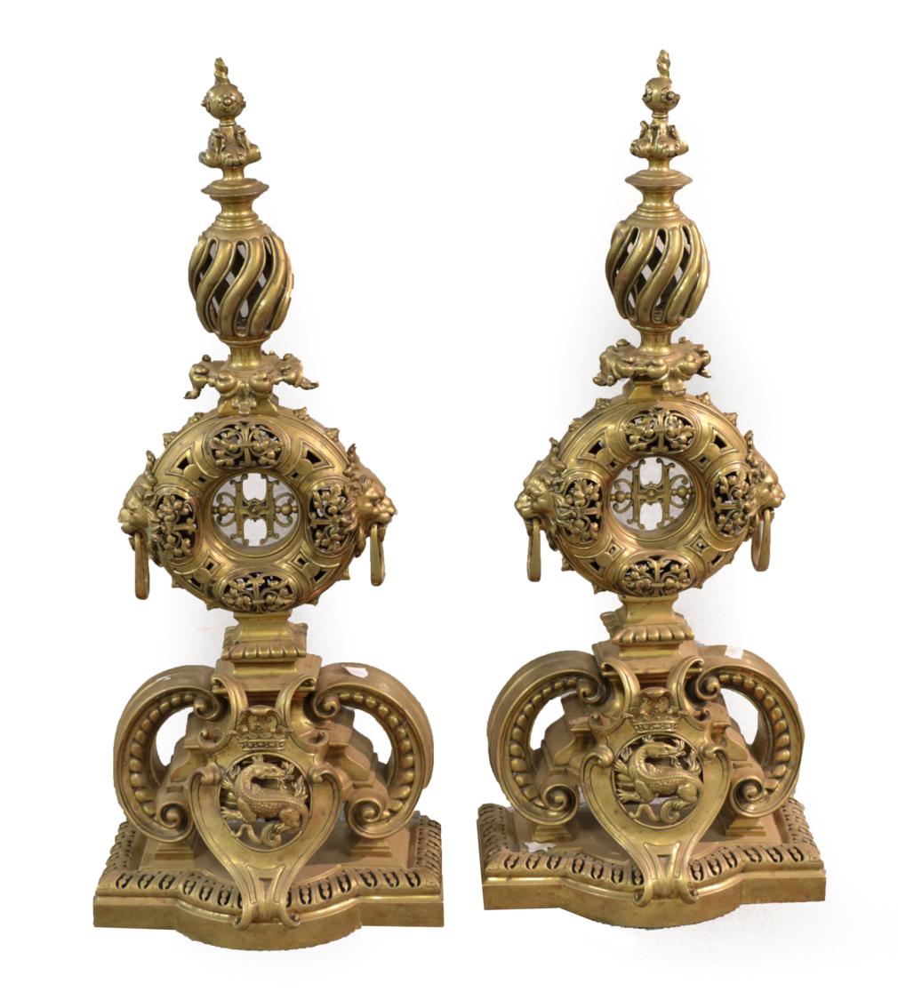 Lot 1304 - A Pair of Large Brass Andirons, 17th century style, with cast and pierced finials, circular columns