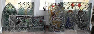 Lot 1306 - A Suite of Ten Stained and Leaded Glass Panels, 19th century, with three rectangular panels...