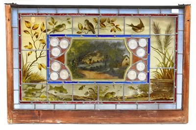 Lot 1307 - A Stained and Leaded Glass Window Panel, late 19th/early 20th century, the central panel with a...