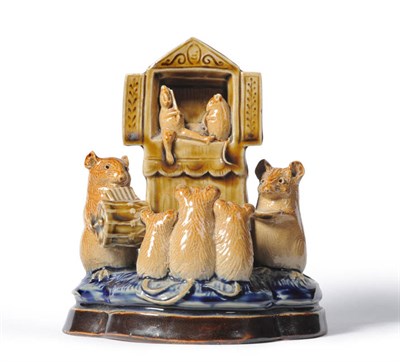 Lot 1416 - A Doulton Lambeth Stoneware "PLAY GOERS" Mouse Group, by George Tinworth, with three small mice...