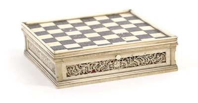 Lot 1323 - A Bone Travelling Chess Board, 19th century, of square box form with chequered hinged lid, fret-cut