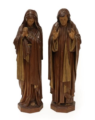 Lot 1342 - A Pair of Carved, Painted and Gilt Oak Figures of Saints, late 19th/early 20th century, her wearing