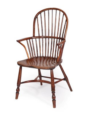 Lot 1346 - A Mid 19th Century Yew Double Spindle Back Armchair, with elm moulded seat on turned legs joined by